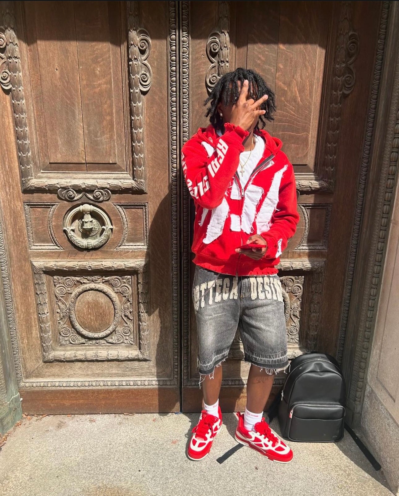 Red “Members Only” zip-up