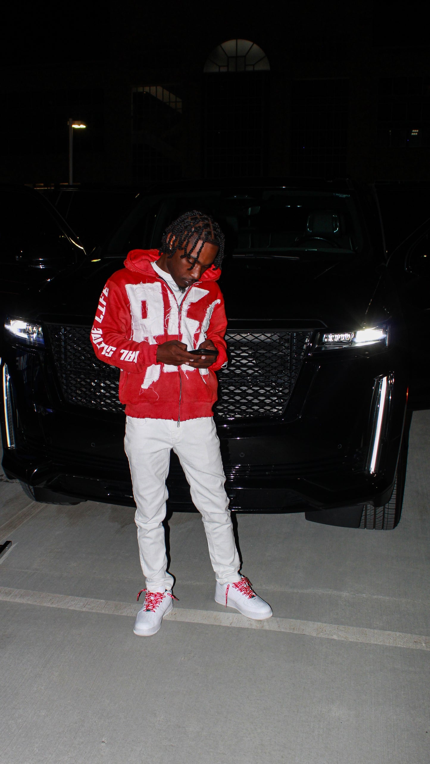 Red “Members Only” zip-up