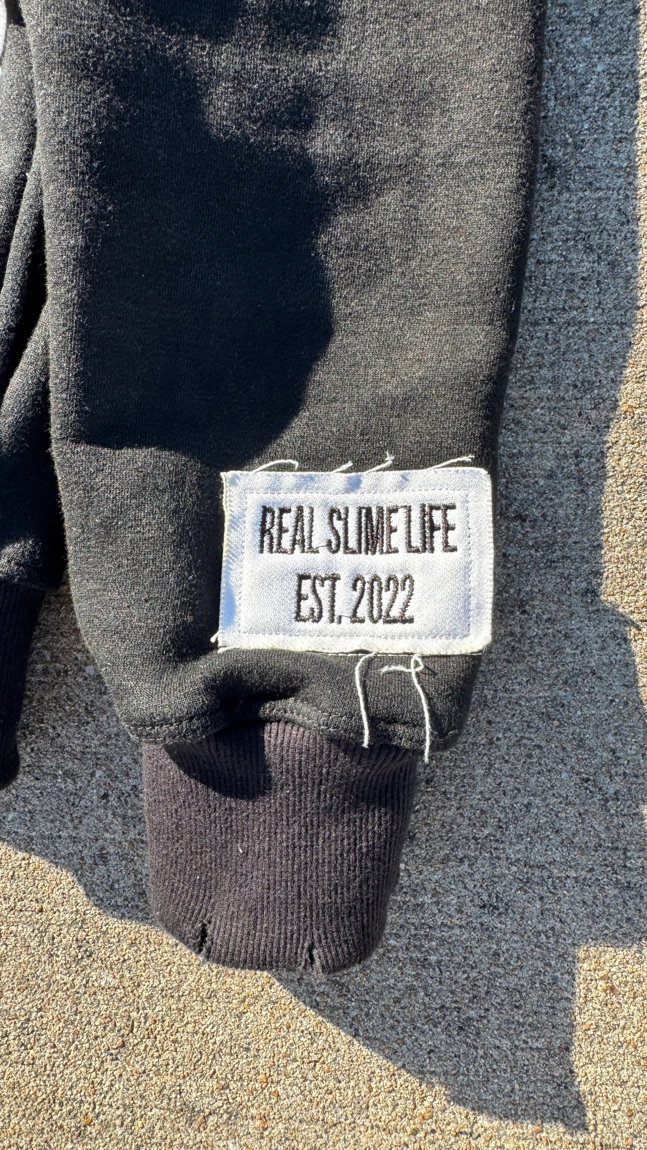 Black “Members Only” zip-up