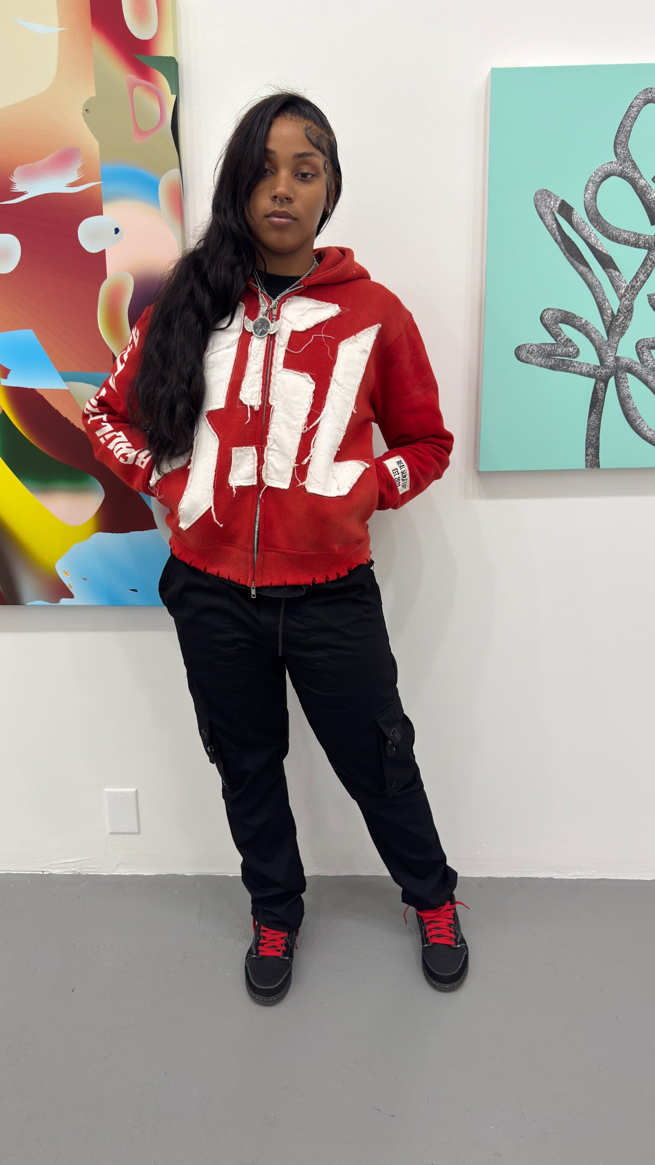 Red “Members Only” zip-up