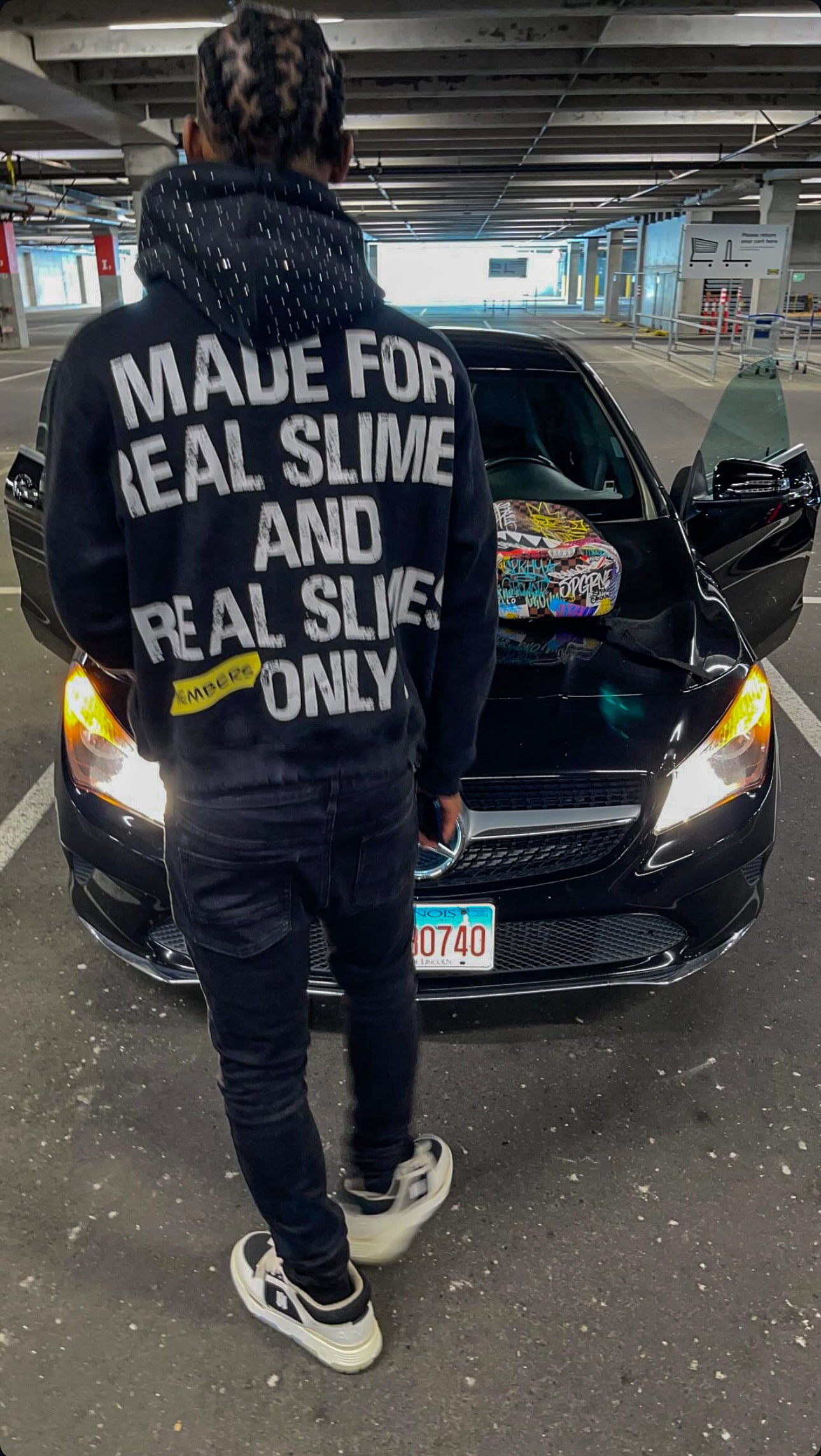 Black “Members Only” zip-up