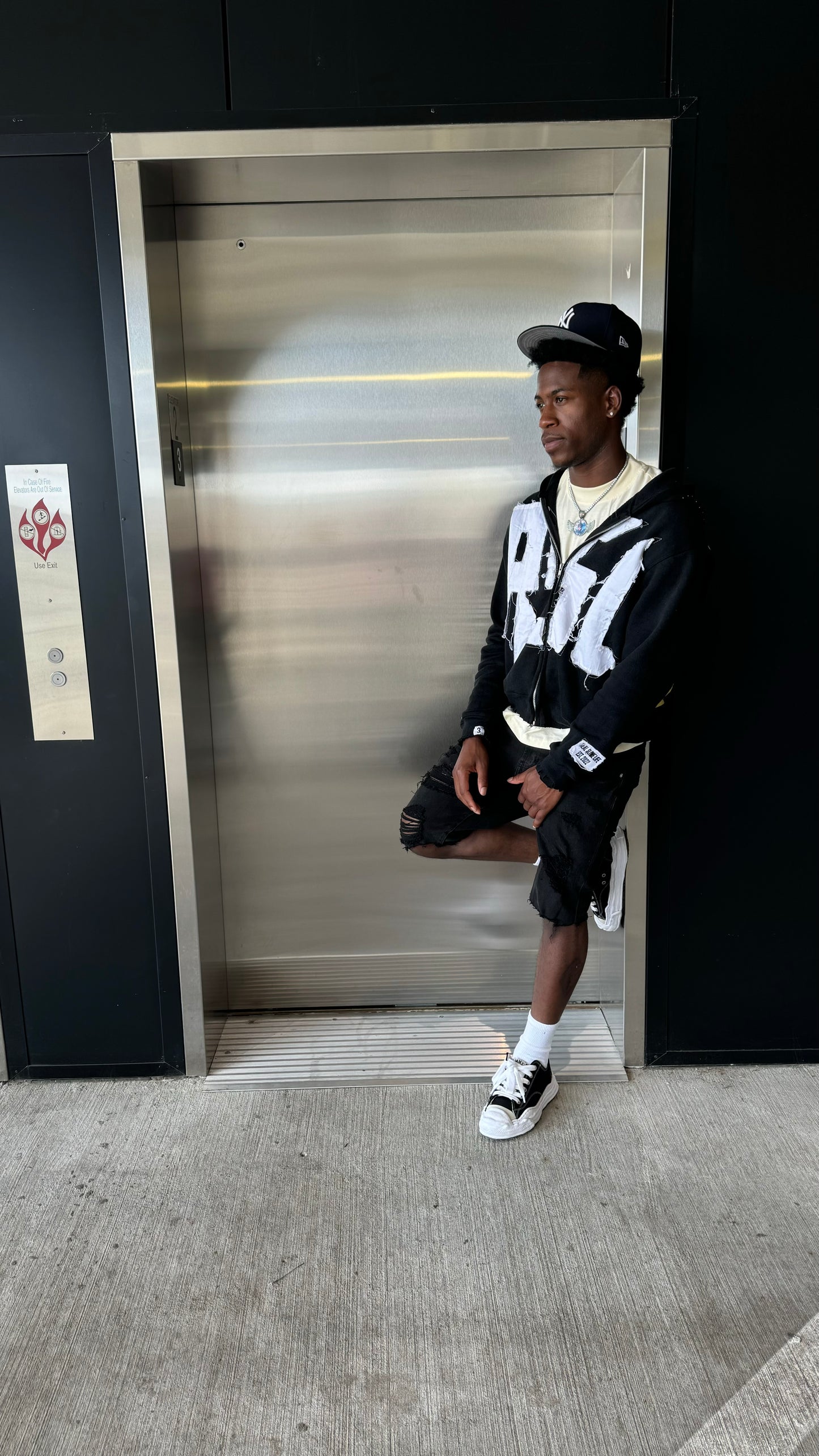 Black “Members Only” zip-up