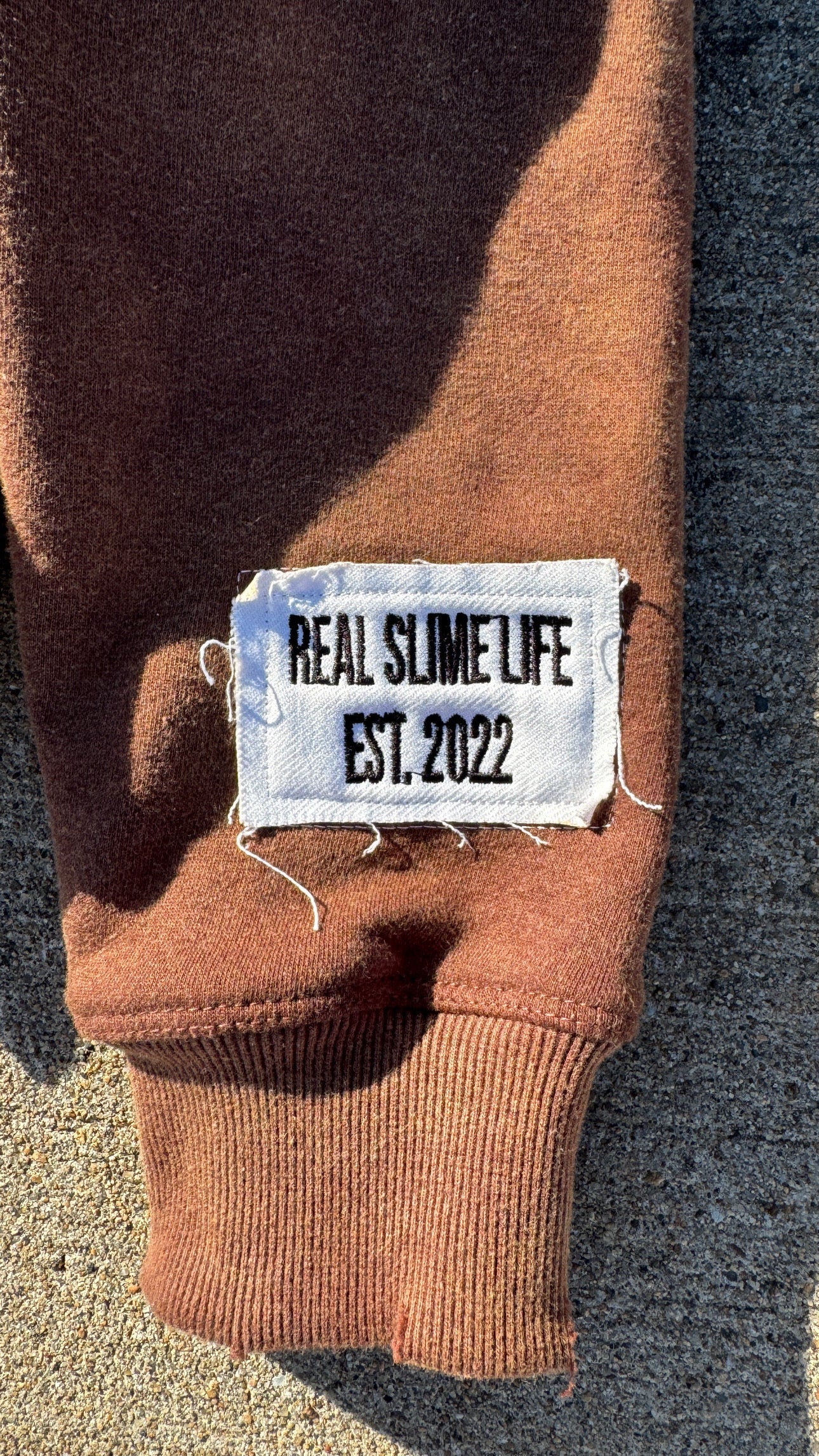 Brown “Members Only” zip-up