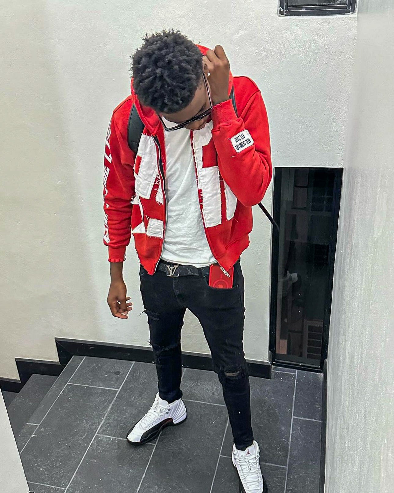 Red “Members Only” zip-up