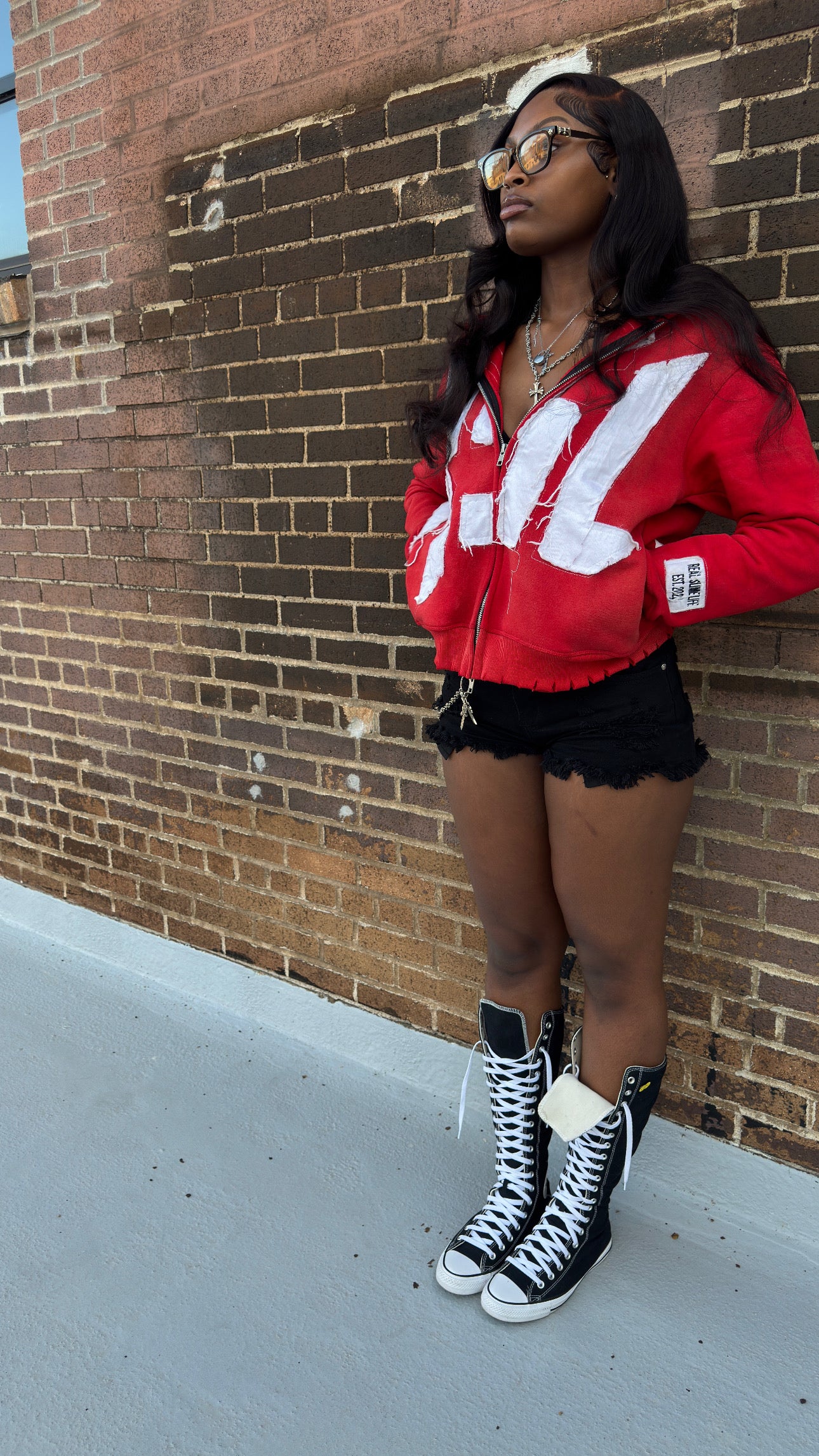 Red “Members Only” zip-up